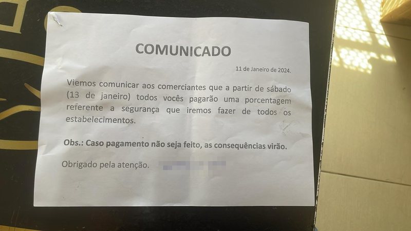 Suspeita de colocar placa no comércio da Vasco da Gama ameaçando comerciantes é presa